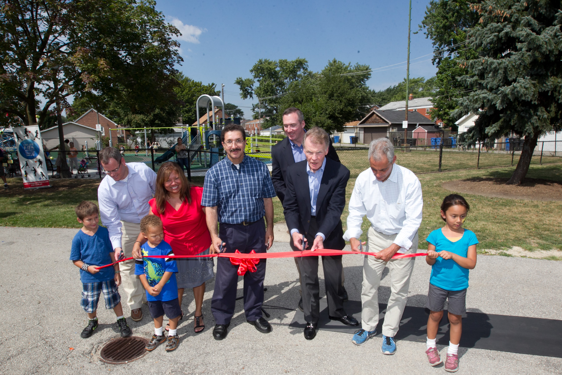 Mayor Emanuel joins Speaker Madigan and community members to celebrate the opening of a newly restored playground at Lawler Park. 